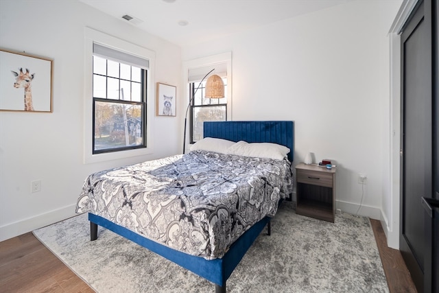 bedroom featuring hardwood / wood-style floors