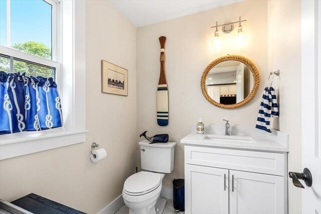 6 Macdonald Ter Unit E, Scituate, MA 02066 - bathroom with baseboards, toilet, and vanity
