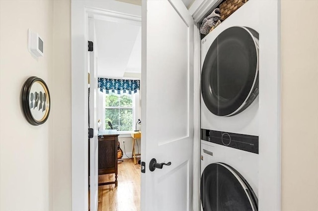 6 Macdonald Ter Unit E, Scituate, MA 02066 - laundry room with stacked washer and clothes dryer and light wood-style flooring