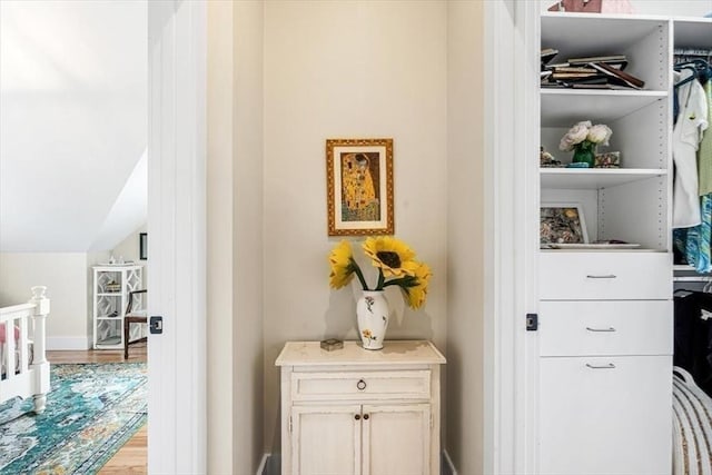 6 Macdonald Ter Unit E, Scituate, MA 02066 - corridor featuring wood finished floors and vaulted ceiling