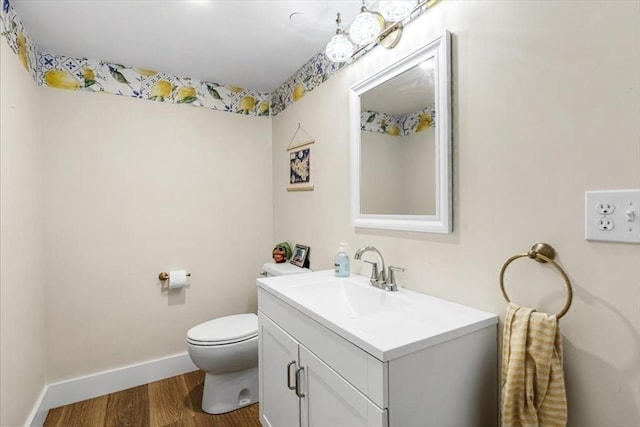 6 Macdonald Ter Unit E, Scituate, MA 02066 - bathroom with wood finished floors, vanity, toilet, and baseboards