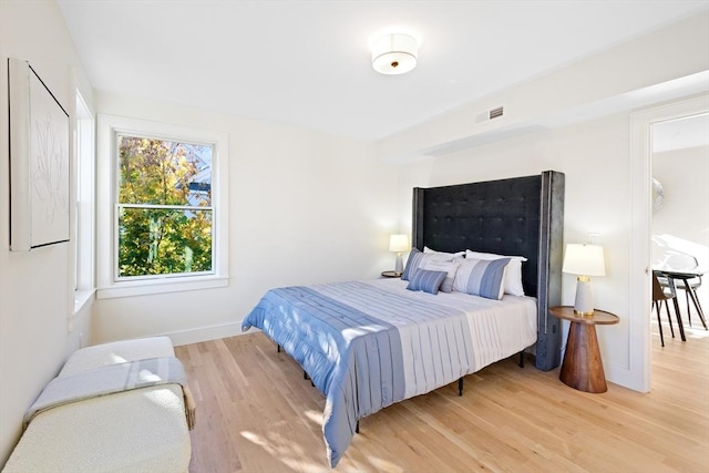 bedroom featuring wood-type flooring