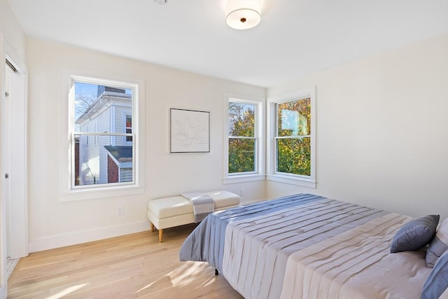 bedroom with light hardwood / wood-style floors