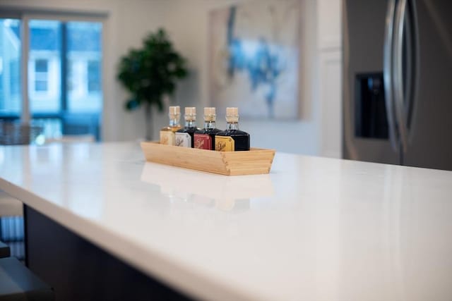 interior details with stainless steel fridge with ice dispenser