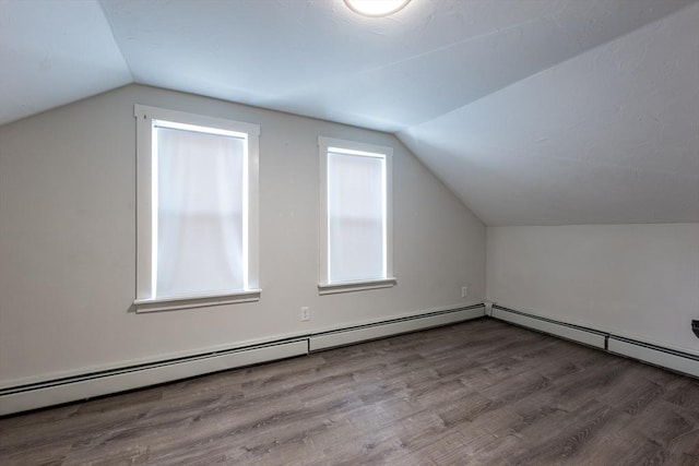 54 Hazard St, New Bedford, MA 02740 - additional living space with vaulted ceiling, wood finished floors, and baseboard heating