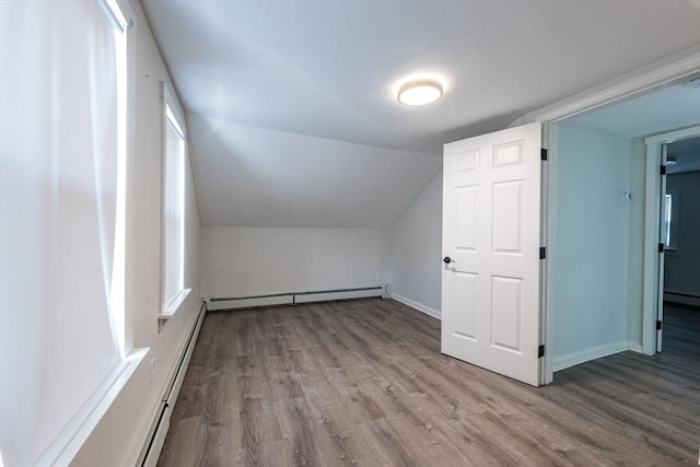 54 Hazard St, New Bedford, MA 02740 - bonus room with a baseboard heating unit, wood finished floors, and lofted ceiling