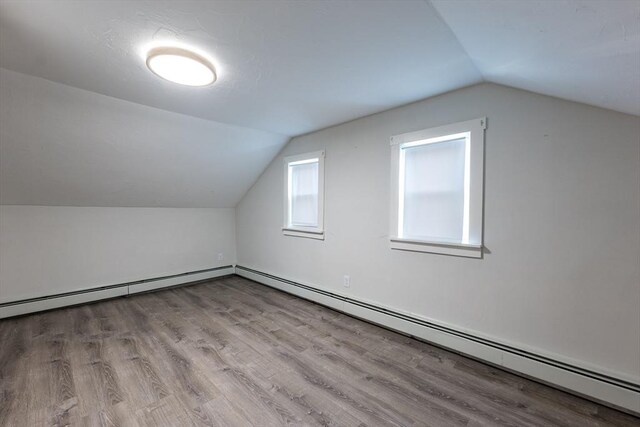 54 Hazard St, New Bedford, MA 02740 - additional living space featuring lofted ceiling, wood finished floors, and a baseboard radiator