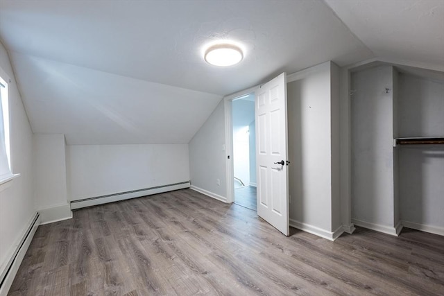 54 Hazard St, New Bedford, MA 02740 - additional living space with a baseboard heating unit, wood finished floors, and lofted ceiling