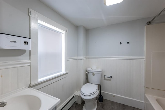 54 Hazard St, New Bedford, MA 02740 - full bathroom featuring a wainscoted wall, a baseboard heating unit, wood finished floors, and shower / washtub combination