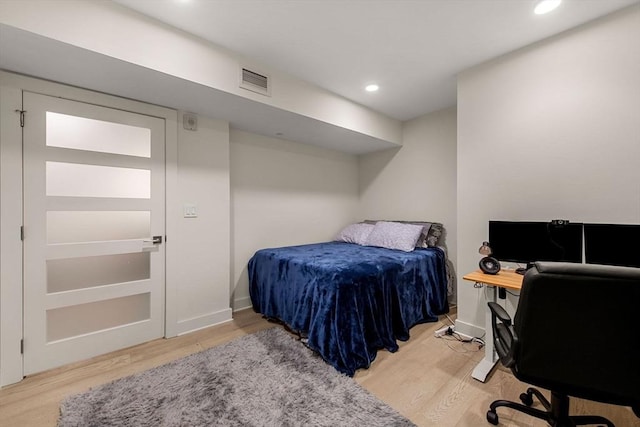 bedroom featuring light wood-type flooring