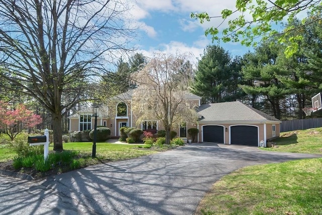 104 Channing Rd, Concord, MA 01742 - view of front of property with asphalt driveway and a garage