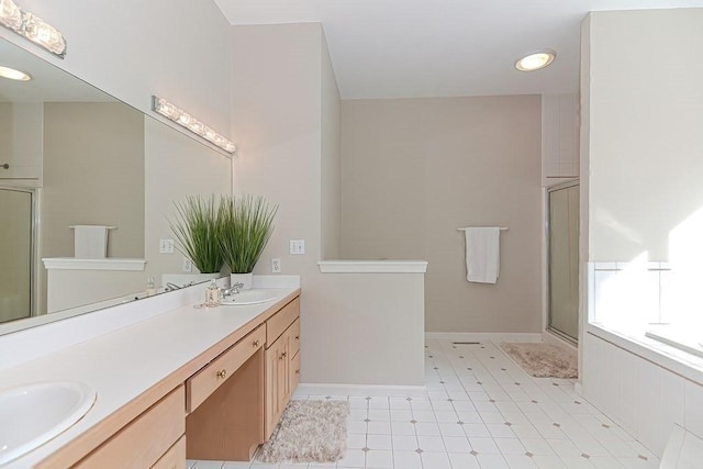 104 Channing Rd, Concord, MA 01742 - full bathroom with a stall shower, double vanity, baseboards, and tile patterned floors