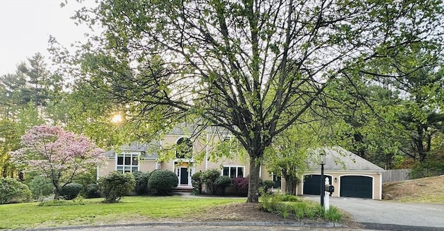 104 Channing Rd, Concord, MA 01742 - obstructed view of property with an attached garage, driveway, and a front lawn