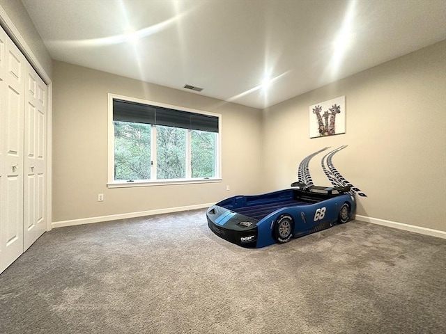 104 Channing Rd, Concord, MA 01742 - unfurnished bedroom with carpet, baseboards, and a closet