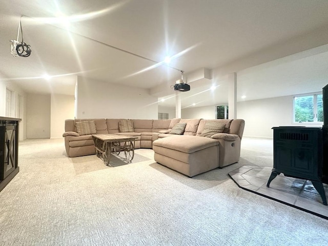104 Channing Rd, Concord, MA 01742 - carpeted living room featuring a wood stove