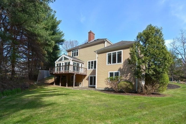 104 Channing Rd, Concord, MA 01742 - back of property with a chimney, a yard, and a deck