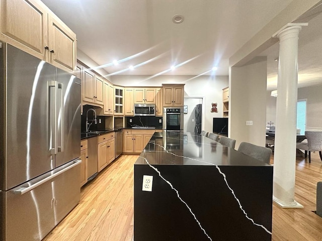 104 Channing Rd, Concord, MA 01742 - kitchen with appliances with stainless steel finishes, a sink, light wood finished floors, and dark countertops