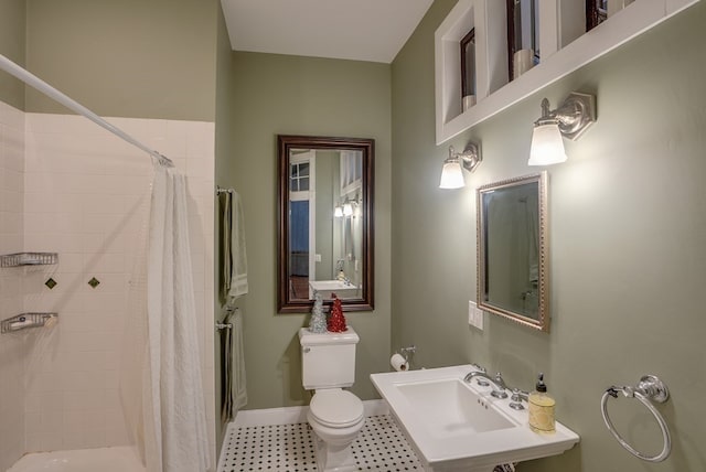 bathroom featuring sink and toilet