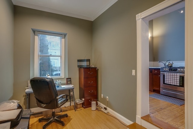 office featuring light hardwood / wood-style floors and ornamental molding