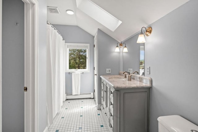 6 Riverview Dr, Newburyport, MA 01950 - full bathroom featuring a baseboard radiator, a skylight, vaulted ceiling, toilet, and vanity