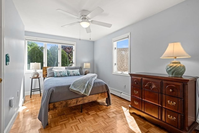 6 Riverview Dr, Newburyport, MA 01950 - bedroom featuring a baseboard heating unit, baseboards, and ceiling fan