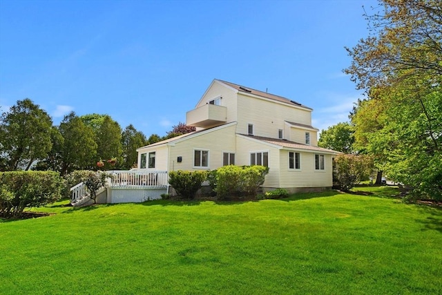 6 Riverview Dr, Newburyport, MA 01950 - rear view of property with a lawn and a wooden deck