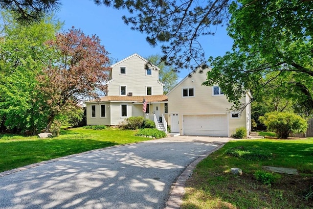 6 Riverview Dr, Newburyport, MA 01950 - traditional home with driveway, an attached garage, and a front lawn