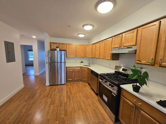 315 Cambridge St Unit 302A, Worcester, MA 01603 - kitchen with appliances with stainless steel finishes, under cabinet range hood, electric panel, and light countertops
