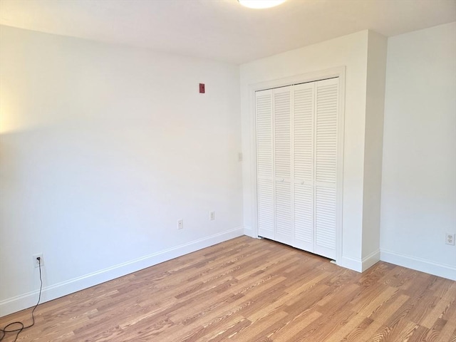 315 Cambridge St Unit 302A, Worcester, MA 01603 - unfurnished bedroom featuring light wood-style floors and a closet