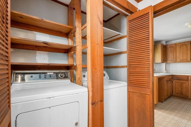 25 Charlotte Ave, Barnstable, MA 02635 - clothes washing area with laundry area, washing machine and clothes dryer, a sink, and light floors