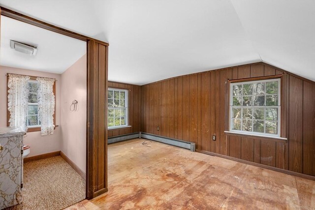 25 Charlotte Ave, Barnstable, MA 02635 - additional living space featuring a baseboard radiator, wooden walls, baseboards, and lofted ceiling