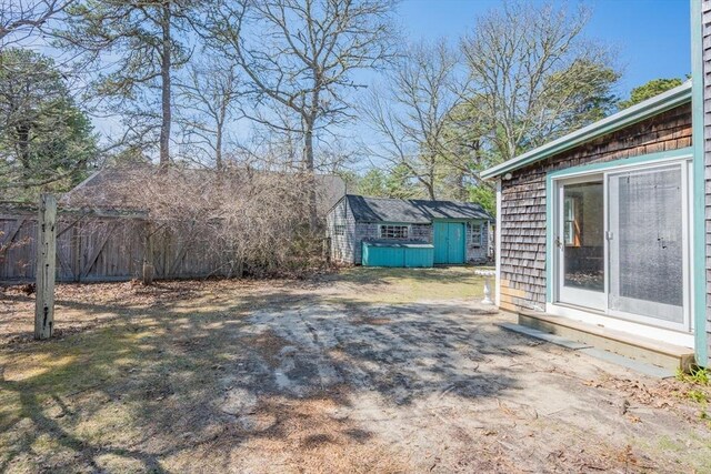 25 Charlotte Ave, Barnstable, MA 02635 - view of yard featuring an outbuilding, entry steps, fence, and a shed