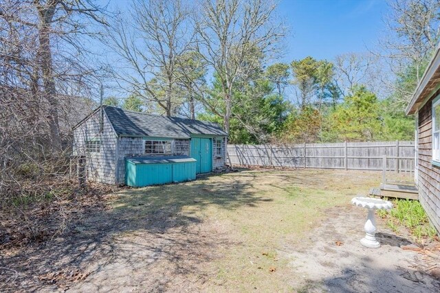 25 Charlotte Ave, Barnstable, MA 02635 - view of yard featuring an outbuilding, fence, and a shed