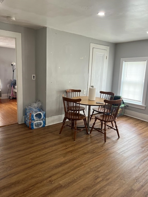 dining area with dark hardwood / wood-style floors