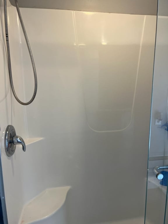 bathroom featuring walk in shower