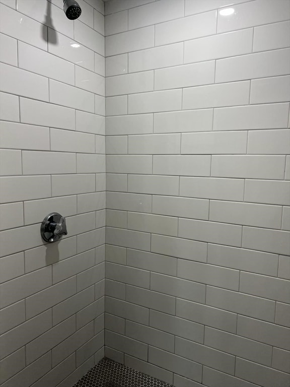 bathroom with a tile shower