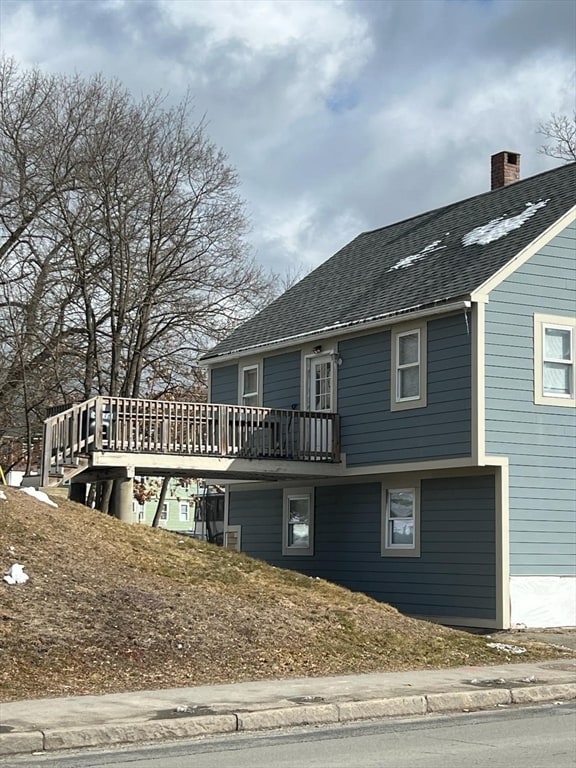 view of front of home with a wooden deck