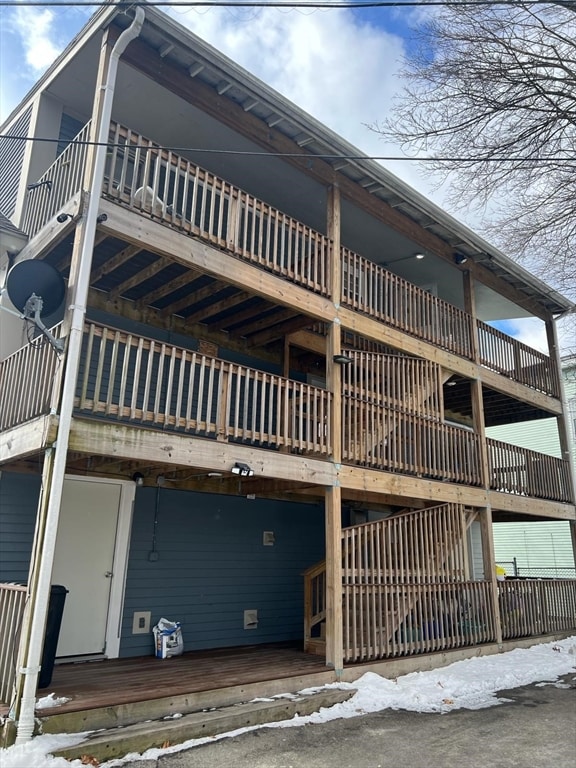 rear view of house featuring a balcony