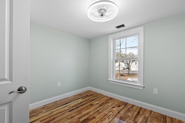 empty room featuring hardwood / wood-style floors