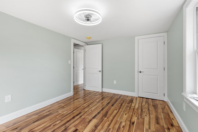 unfurnished bedroom featuring hardwood / wood-style flooring