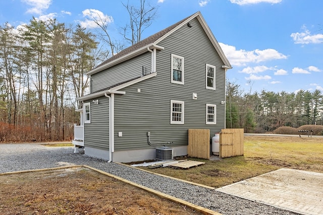 view of property exterior with central AC