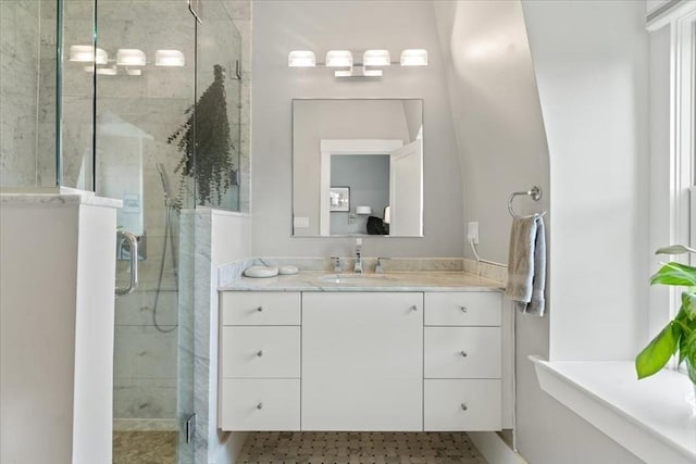 full bathroom featuring a shower stall and vanity