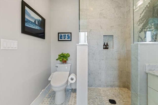 full bath featuring walk in shower, toilet, and baseboards