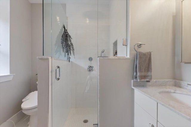 full bath with toilet, a stall shower, vanity, and tile patterned floors