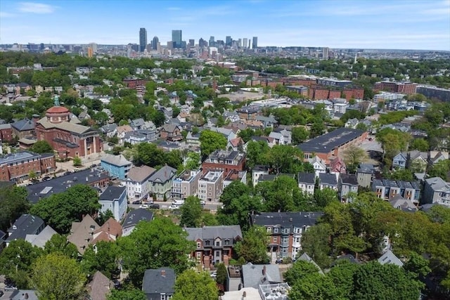 aerial view of property's location featuring nearby urban area