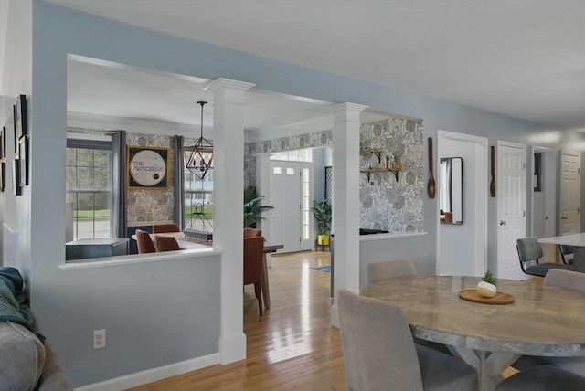 73 Sparrow Way, Raynham, MA 02767 - dining area with baseboards, decorative columns, and wood finished floors