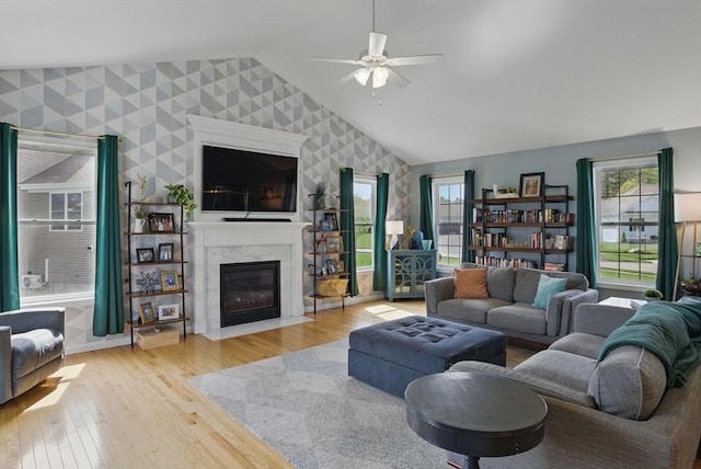 73 Sparrow Way, Raynham, MA 02767 - living area featuring wallpapered walls, plenty of natural light, vaulted ceiling, and ceiling fan