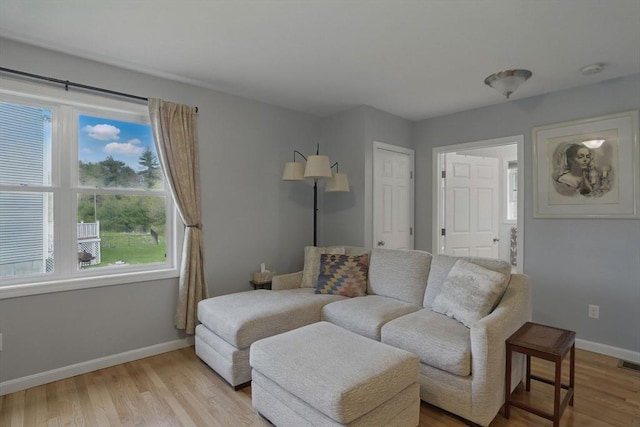 73 Sparrow Way, Raynham, MA 02767 - living room featuring baseboards, visible vents, and light wood-type flooring