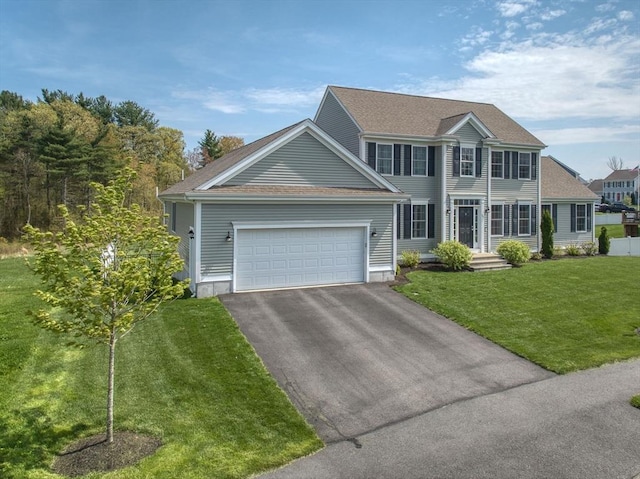 73 Sparrow Way, Raynham, MA 02767 - colonial house with aphalt driveway, roof with shingles, a garage, and a front yard