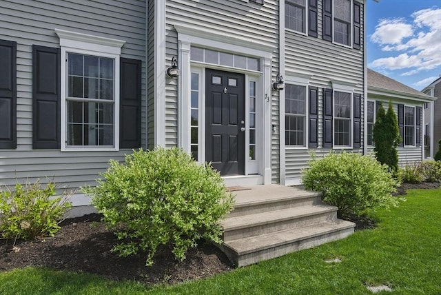 73 Sparrow Way, Raynham, MA 02767 - view of exterior entry featuring a yard